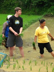 Me planting rice at a town outside Guiyang City were residents earn only $200-300 U.S. dollars per year